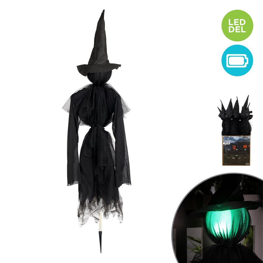 Piquet de sorcière noire avec tête lumineuse verte