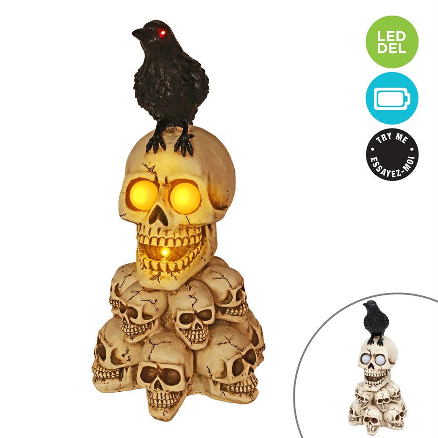 Pile de crânes lumineuse avec corbeau