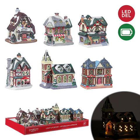 Small illuminated Christmas village house